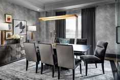 an elegant dining room with gray and black decor