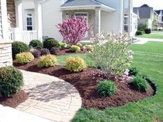 landscaping in front of a white house