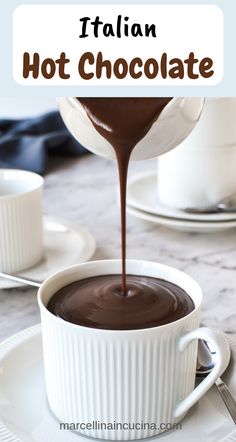 chocolate sauce being poured into a cup with the words italian hot chocolate on top and below