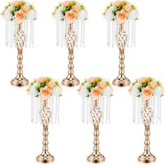 six gold vases with flowers in them