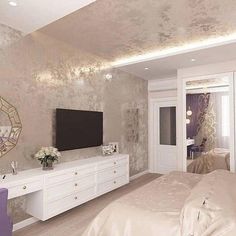 the bedroom is decorated in white and gold