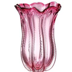 a pink glass vase sitting on top of a table