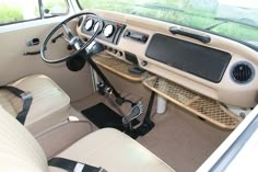 the interior of a car with beige leather seats