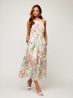 Transport yourself to a tropical paradise with this exotic midi-length dress made of botanical palm print. The lightweight linen fabric provides a breathable feel and drapes beautifully, adding an extra layer of refinement to your look. Ideal for attending a garden party, a beachside soiree, or simply enjoying a leisurely day out, this dress is your go-to choice for effortless style. Botanical Palm Linen Print: 100% Linen Made in the USA of imported fabric Dry Clean Only Length: 52 3/4 inches (s Tropical Midi Dress For Beach With Tropical Print, Tropical Midi Dress For Beach, Vacation Linen Dresses With Floral Print, Beach Linen Dress With Floral Print, Spring Vacation Maxi Dress With Palm Tree Print, Tropical Maxi Dress With Tropical Print For Garden Party, Tropical Sleeveless Midi Dress For Garden Party, Tropical Print Dress For Brunch, Summer Leaf Print Maxi Dress