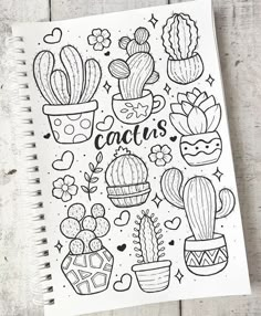 a notebook with cactus drawings on it