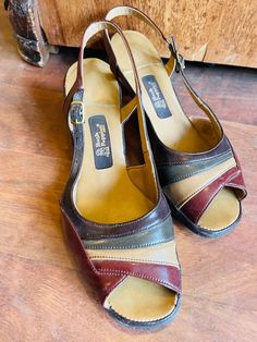 "These colorblock or striped 1980s hush puppy sandals are just the cutest thing! They have the cutest vintage shades of green beige and burgundy, and are a women's size 8, though of course please check the measurements given below to ensure a proper fit. There is light wear to insole and outsole and some small damage to the heel. See pics. They were made in the USA and are all man made materials. Measurements: 2\" heel, 9 7/8\" insole" Retro Slingback Summer Sandals, Retro Slingback Sandals For Summer, Vintage Closed Toe Sandals, Retro Closed Toe Sandals, Vintage T-strap Sandals For Spring, Vintage Closed Toe T-strap Sandals For Summer, Vintage Closed Toe T-strap Sandals For Spring, Spring Vintage T-strap Sandals, Vintage Sandals 1980