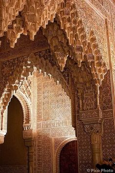 an intricately carved wall and ceiling in the alhambra palace, marraket, morocco