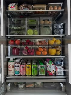 an open refrigerator filled with lots of different types of fruits and vegetables in bins