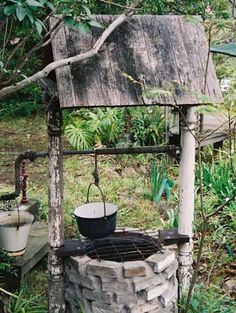 an old brick oven in the middle of a garden