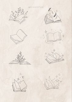 an open book sitting on top of a table next to flowers and stars in the sky