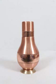 QUALITY FIRST - Hand crafted copper water bottle made of pure copper, quality tested and delivered with a promise of 100% satisfaction. HANDCRAFTED WITH PASSION TO PERFECTION - Offers The Defining Edge Of Style And Utility. LEAK PROOF & JOINTLESS DESIGN - Very easy to clean. Handwash with limewater, salt and luke warm water. Do not scrub / brush the outer surface. HEALTH BENEFITS - Stimulating the brain, regulating thyroid function, reducing joint pain, aiding digestion, slowing down ageing, fighting anaemia, healing wounds faster, fighting cancer, improving skin health, and aiding melanin function. PREMIUM AYURVEDIC HEALTH BENEFITS - Ayurveda recommends storing water overnight and drinking in the morning to get the benefits. THE PERFECT GIFT - Our premium quality copper water bottles come Heal Wounds Faster, Copper Bottle, Copper Water Bottle, Lime Water, Storing Water, Healthy Water, Thyroid Function, Mardi Gras Gifts, Scrub Brush