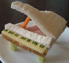 there is a sandwich made to look like a piece of bread with an orange carrot sticking out of it