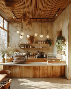 a counter in a restaurant with lots of bottles on the shelves and lights hanging from the ceiling