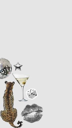 an animal is sitting next to a martini glass and other items that are floating in the air