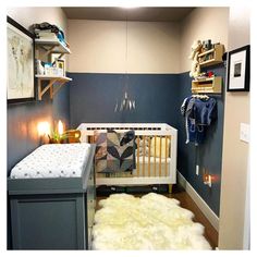 a baby's room with a crib, dresser and bed in the corner