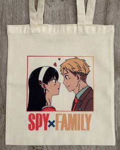 SPY X FAMILY: YOR X LOID TOTE BAG Carry your essentials with this cute tote bag! Featuring Yor and Loid from Spy x Family, this bag can be used for any type of occasion: shopping, school, university, beach day, traveling. Use it as you wish and give a unique and special touch to your outfit. Get yours today! Vintage Beige Approx. 15 x 13 inch Canvas Hand Wash Only Spy X Family Tote Bag, Spy X Family Yor, Cute Tote Bags, Spy X Family, Caicos Islands, Turks And Caicos, Turks And Caicos Islands, Trinidad, Trinidad And Tobago