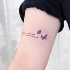 two butterflies on the arm with a quote