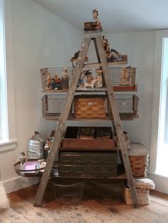 an old ladder is used as a shelf in the corner of a room with baskets and other items