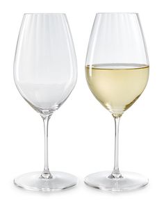 two wine glasses with white wine in them