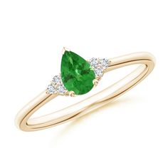 A captivating bright green tsavorite is secured in a prong setting and flanked by sparkling diamond clusters. Designed in 14k yellow gold, this pear-shaped tsavorite ring has an elegant and stylish appeal. Teal Sapphire Ring, Tsavorite Ring, Montana Sapphire Ring, Sapphire Solitaire Ring, Teal Sapphire, Sapphire Solitaire, Montana Sapphire, Brilliant Diamond, Diamond Cluster