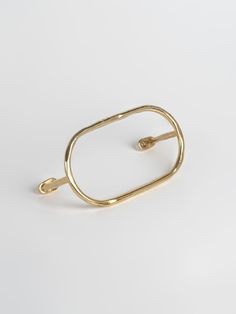 a gold ring on a white background