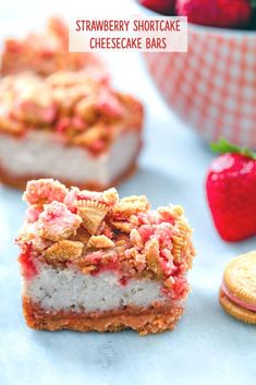 strawberry shortcake cheesecake bars are stacked on top of each other