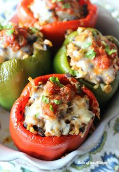 stuffed bell peppers with meat and cheese in a white bowl