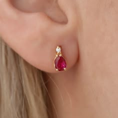 Discover the enchanting allure of our 14K Solid Gold Solitaire Real Diamond Drop Stud Earrings, featuring the radiant ruby, July's birthstone. Crafted with meticulous attention to detail, each earring showcases a premium-grade real diamond at the pinnacle, cascading into a vibrant ruby gemstone, symbolizing love, courage, and passion. Created with the finest 14K solid gold, these earrings promise not only a touch of daily luxury but also durability to last through generations. These earrings mea Ruby Earing Designs, Elegant Red Jewelry For Birthday, Ruby Earrings In Yellow Gold For Gift, Gold Earrings Designs For Daily Use, Elegant Ruby Diamond Earrings, Classic Gold Ruby Earrings, Ruby Yellow Gold Earrings For Gift, Gold Ruby Earrings, Pierced, Daily Luxury