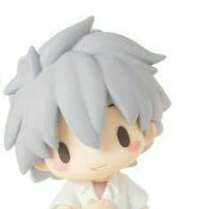 an anime figurine is sitting on a white surface with his hands folded in front of him