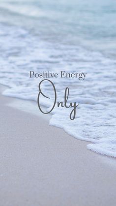 the words positive energy only are written in front of an image of water and sand