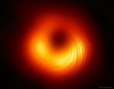 an orange and red swirl on a black background