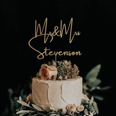 a wedding cake with flowers and greenery on top that says mr and mrs steenson