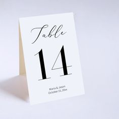 a table number card with the numbers 11 and 11 in black ink on white paper