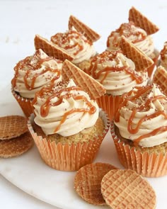 cupcakes and crackers on a white plate with caramel drizzle