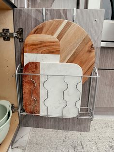 some cutting boards are in a metal rack