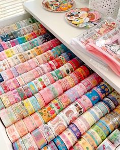 many rolls of japanese washi tapes are stacked on top of each other