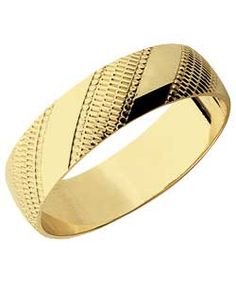 a yellow gold wedding ring with an intricate design