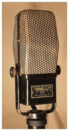 an old fashioned microphone on a tripod