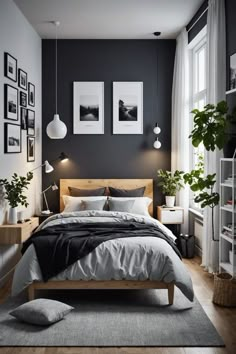 a bedroom with black walls and white bedding, two pictures on the wall above the bed