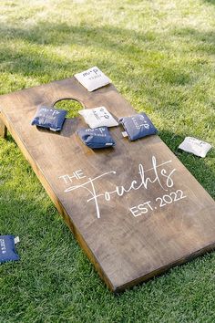 a cornhole board that has been set up on the grass for an outdoor game