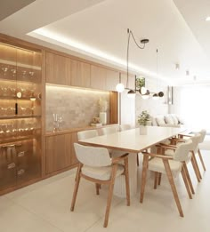 a dining room table surrounded by chairs and shelves with wine glasses on the wall behind it