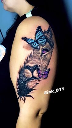 a woman's arm with a lion and butterfly tattoo on the side of her body