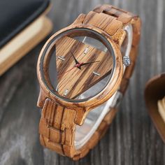 THE VIENNA Wooden Watch ✅ Free Gift Box ✅ Free UK 2-3 Day Delivery ✅ Free Worldwide Delivery ✅ 12 Months Warranty ✅ Made From Sustainable Wood ✅ Buy With Confidence - We have been supplying watches through our various channels worldwide for over 4 years and have a large and happy customer base D E S C R I P T I O N Looking for a unique gift? This creatively designed timepiece is a great way to show that special person you care and will be remembered for a lifetime. With its stylish and unique design, it can be used for everyday wear and special occasions D E T A I L S Colour: Zebrawood Movement: Japanese 2035 MAJOY Quartz Dial Window Material: Acrylic Case Diameter: 43mm Case Shape: Round Case Material: Wood Dial Diameter: 34mm Clasp Type: Folding Clasp With Safety Strap Width: 18mm Strap Natural Luxury, Handmade Watch, Handmade Bangles, Wooden Watch, Watches Unique, Unisex Watches, Trendy Gift, Wood Watch, Quartz Watch