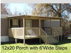 a mobile home with porch and wide steps