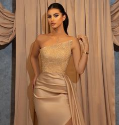 Beige Evening Dress With Sweep Train For Party, Beige Party Dress With Sweep Train, Beige Party Gown With Sweep Train, Beige Gown For Prom Season Party, Beige Gown For Party And Prom Season, Beige Gown For Party During Prom Season, Glamorous Beige Evening Dress For Prom, Champagne Sleeveless Evening Dress With Sweep Train, Sequined Sleeveless Satin Gown