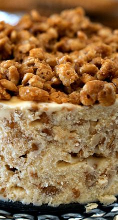 a close up of a cake on a plate with other food items in the background