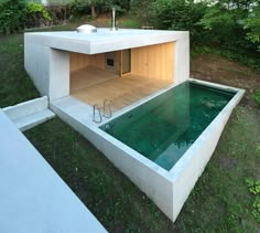 an outdoor swimming pool in the middle of a yard