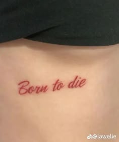 a woman's stomach with the word born to die written in red ink on it