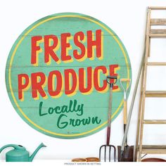 there is a sign that says fresh produce locally grown on the side of a wall