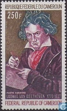 a stamp with an image of a man writing on paper and holding a pen in his right hand